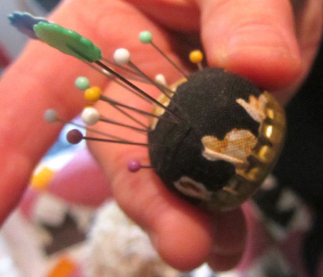 QG bottle cap pincushion